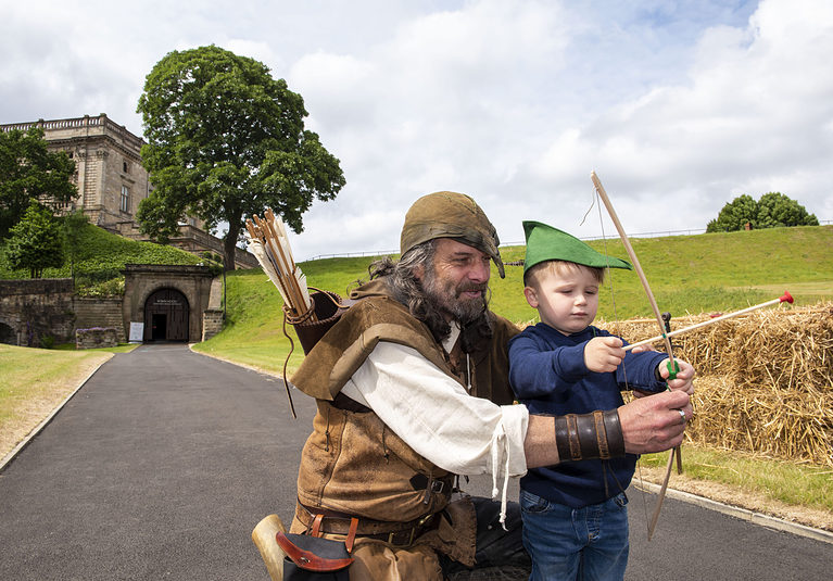 Samuel Ridley (age 4) has an archery lesson from Robin Hood as the castle opens for the first time in three years